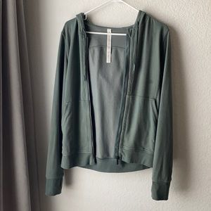 Green Lululemon zip up sweatshirt.